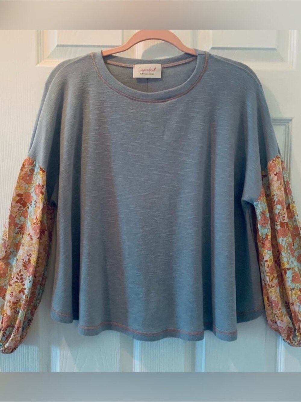 Sugar Fox Mixed Media Oversized Blue Top with Floral Sleeves • Size Small